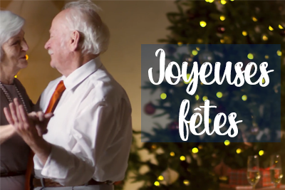 Un couple dansant devant un sapin de Noël avec les mots joyeuses fêtes.